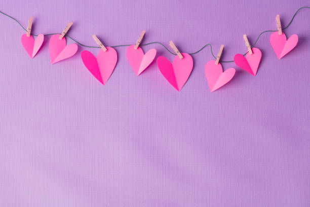 istock Paper hearts hanging on a clothesline with space for copy 1356409134