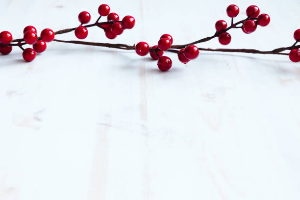 istock Border of vibrant red berries on white 1356409205