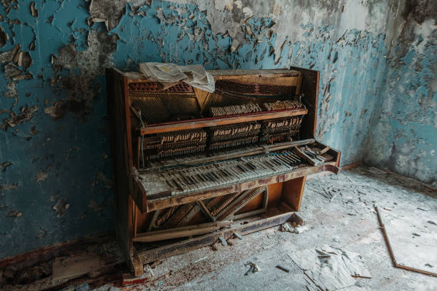 istock Old piano in a run down house 1356410156