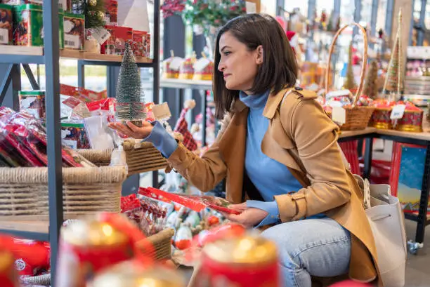 Woman Shopping At Christmas Market