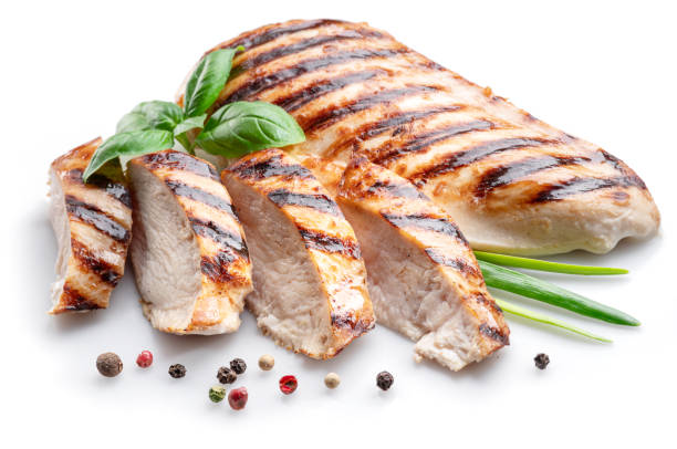 istock Grilled chicken fillet with herbs isolated on white background. 1356410526