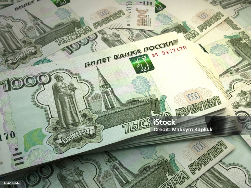 Russian banknotes. Russianruble bills. 1000 RUB rubles. Business, finance background. Money of Russia. Russian ruble bills. RUB banknotes. 1000 rubles. Business, finance, news background. Russian Rubles Stock Photo
