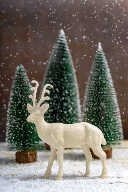 istock Christmas trees and reindeer 1356412225