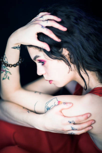 istock Girl with tattoo on arm 1356413136