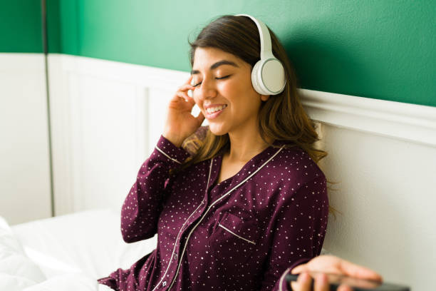 istock Relaxing with music in bed 1356413147