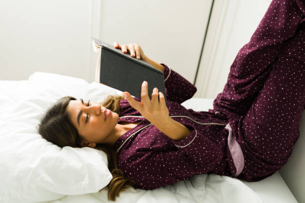 istock Smart woman enjoying a book 1356414368