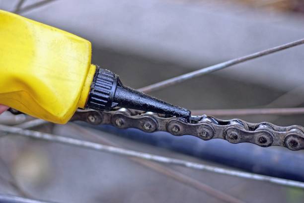 istock one yellow black plastic tube oils a rusty gray chain 1356414925