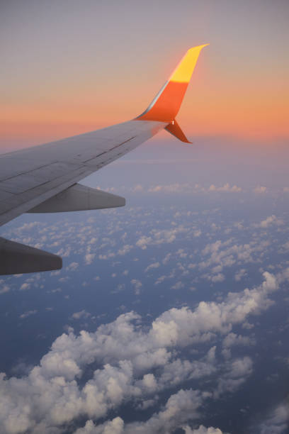 istock Beautiful clouds in the aircraft's porthole 1356416676
