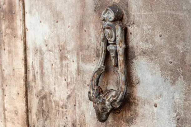 Photo of old metal goat head shaped doorknob