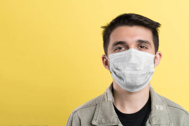 istock Handsome man wearing a face mask 1356424119