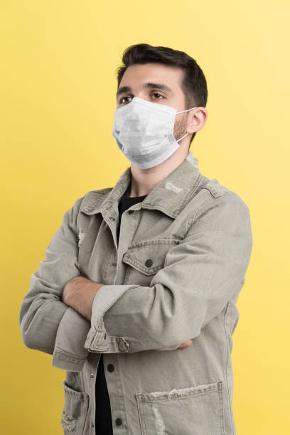 istock Handsome man wearing a face mask 1356424381