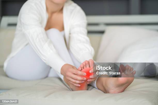 Joint Diseases Hallux Valgus Plantar Fasciitis Heel Spur Womans Leg Hurts Pain In The Foot Massage Of Female Feet At Home Stock Photo - Download Image Now