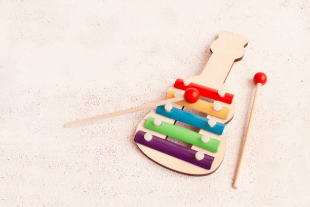 istock Children's rainbow xylophone on a light background. Metallophone for children. 1356426721