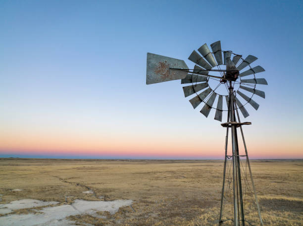 istock dusk over over Colorado plains with windmill 1356426871