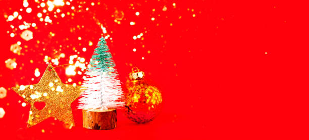 istock Gold star and decorative Christmas tree on red background. Christmas decor. Creative copy space. 1356428719