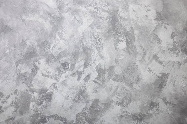 istock Gray textured concrete wall as background. Cement or stone surface with space for text 1356428863