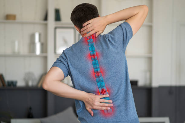 intervertebral hernia, neck and lumbar pain, man suffering from backache at home, spinal disc disease - menselijke nek stockfoto's en -beelden