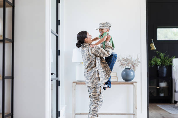 istock Female soldier returns home 1356430784