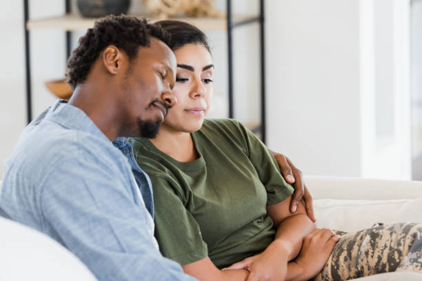 istock Husband happily embraces soldier wife 1356430990