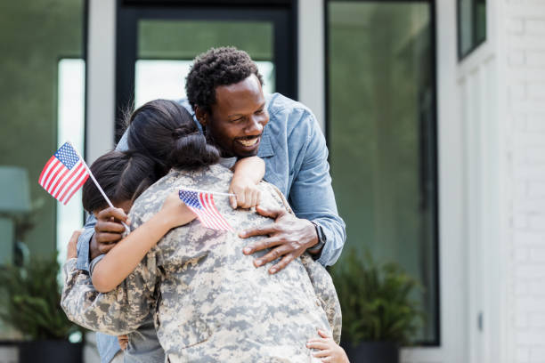 istock Family hugs unrecognizable soldier mom 1356431234