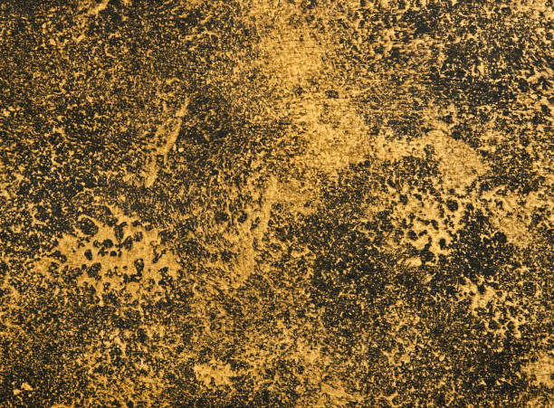 istock Abstract grunge golden and black background 1356431381