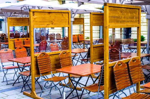 tables with separation at a beergarden in munich