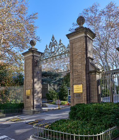 New York, NY - November 23, 2021: The 68th St gate and main entrance to Rockefeller University on First Avenue in the Upper East Side of Manhattan, NYC. Rockefeller University is a private graduate university focused on the biological and medical sciences.