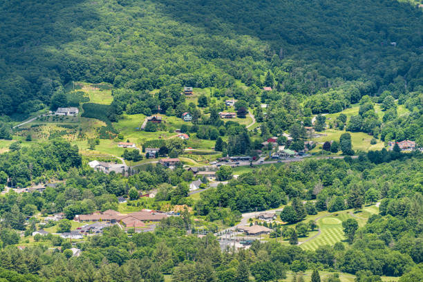 Cityscape high angle above view of Banner Elk town city in summer in North Carolina in Blue Ridge Appalachia viewed from Sugar Mountain ski resort Cityscape high angle above view of Banner Elk town city in summer in North Carolina in Blue Ridge Appalachia viewed from Sugar Mountain ski resort appalachian mountains stock pictures, royalty-free photos & images