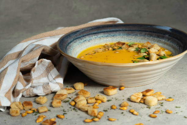 istock Creamy pumkin soup with croutons 1356437079