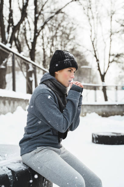 istock Young athletic woman during her outdoors winter workout 1356438306