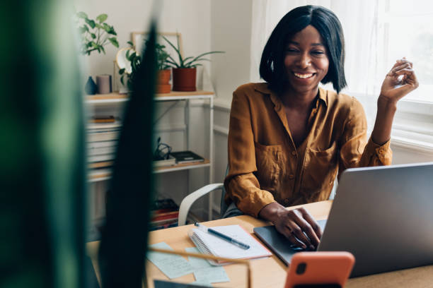 istock Happy Business Woman Working from Home on Laptop Computer 1356438322