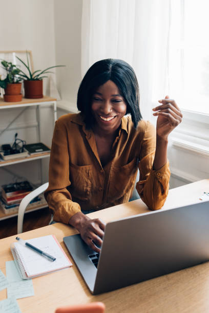istock Happy Business Woman Working from Home on Laptop Computer 1356438324