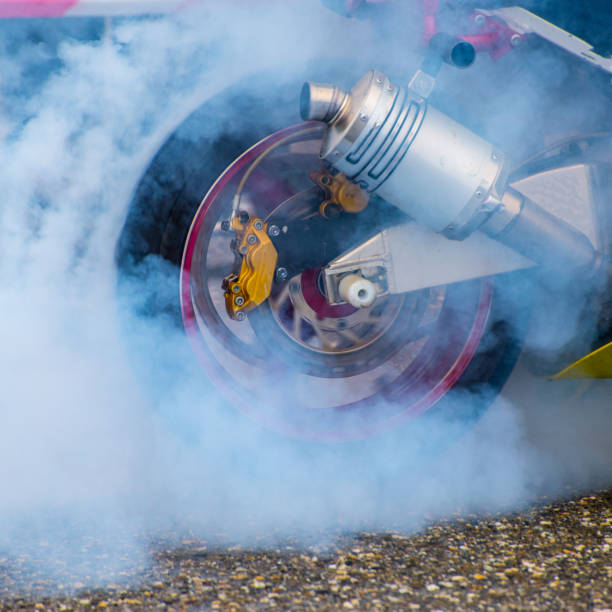 istock Modern motorcycle motorbike with smoke drifting in motion 1356438799