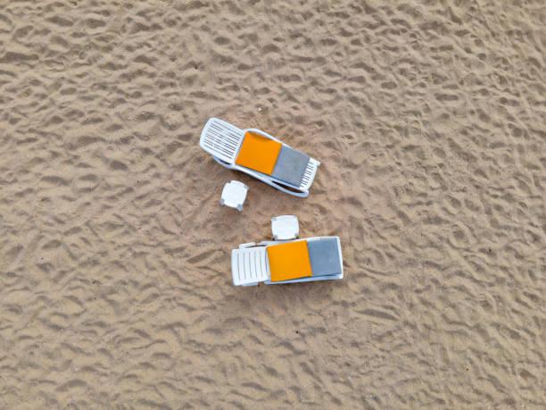 Sunbeds tables on the lonely sand sea beach. High quality photo