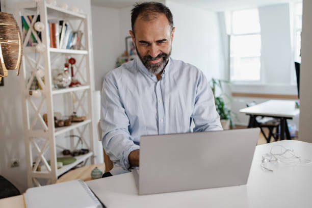 istock Mature man working on the laptop 1356439686