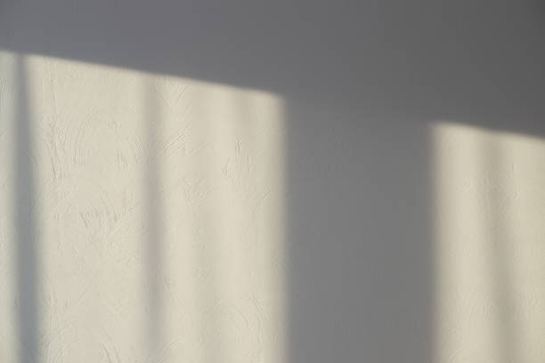 istock Window shade on a gray wall with decorative plaster. Textured background, template with copy space 1356441033