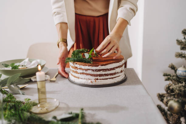 istock Christmas Preparation: An Anonymous Woman Setting Up Christmas Dinner Table 1356441047