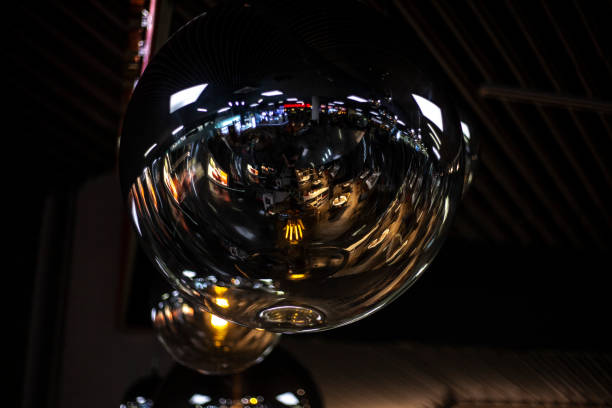 istock Fancy lamps on the ceiling. Glowing balls. Indoor lighting design. Spherical transparent containers for diffusing light. 1356442182