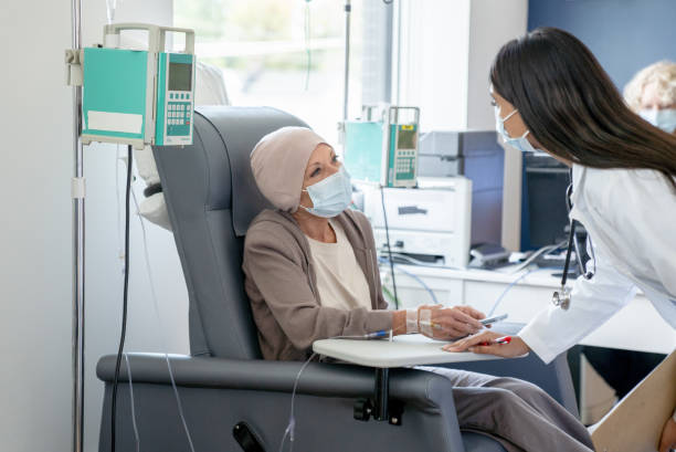 istock Doctor Checking in on Cancer Treatment 1356442520