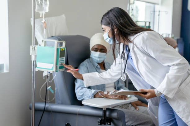 istock Doctor Changing the Intravenous Dosage 1356442521