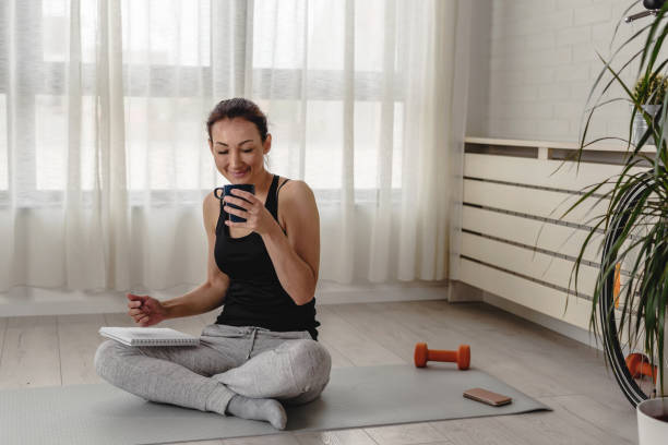 istock Young woman writing in her notebook Personal growth resolutions 1356445918