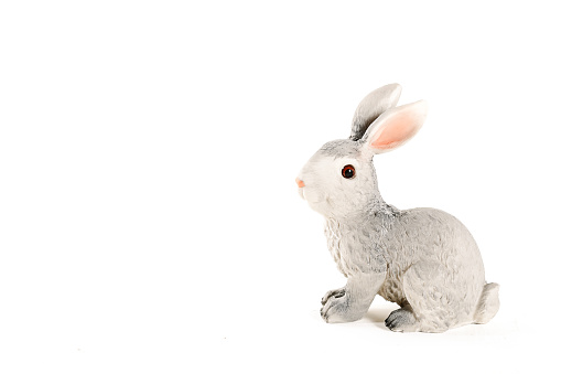 figurine of a hare on a white background. Easter minimalistic concept.