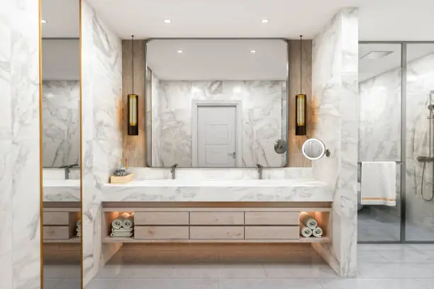 Interior of a modern luxurious bathroom with white marble.