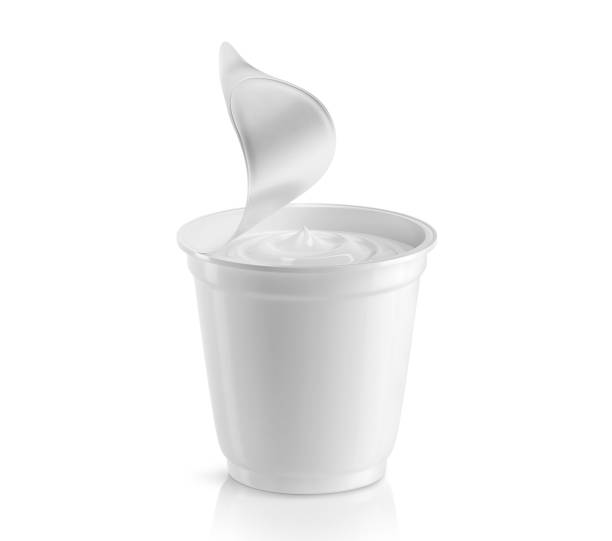 Plastic cup with sour cream 3D render Full plastic cup with sour cream with an open foil lid. Isolated on white background. 3D illustration yogurt stock pictures, royalty-free photos & images