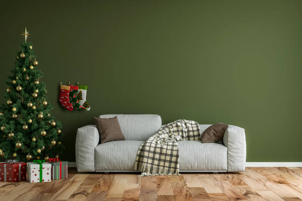 istock Empty simple living room with gray sofa, Christmas tree and gifts 1356449312
