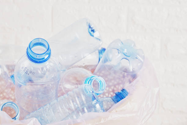 collection of plastic bottles in the trash can - polyethylene terephthalate imagens e fotografias de stock