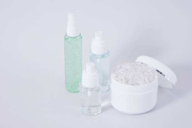 istock Composition of different cosmetic bottles mock-up on gray background 1356450543