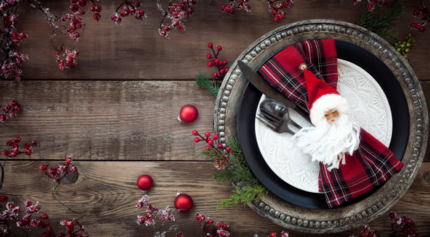 istock Holiday Christmas Dining Plate on an Old Wood Table 1356456892