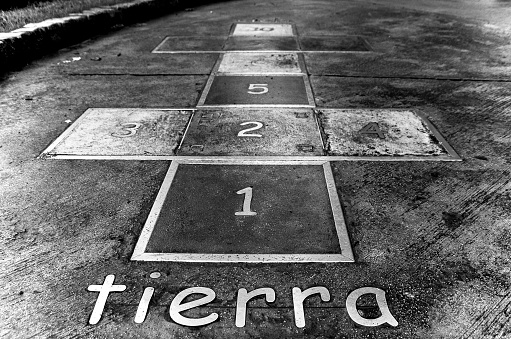 hopscotch game for children in the asphalt playground. black and white photograph