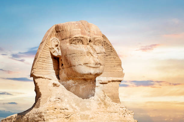 istock The great ancient Sphinx on a blue background. iconic Sphinx carving adjacent to the Great Pyramids at Giza, Egypt. copy space 1356461791